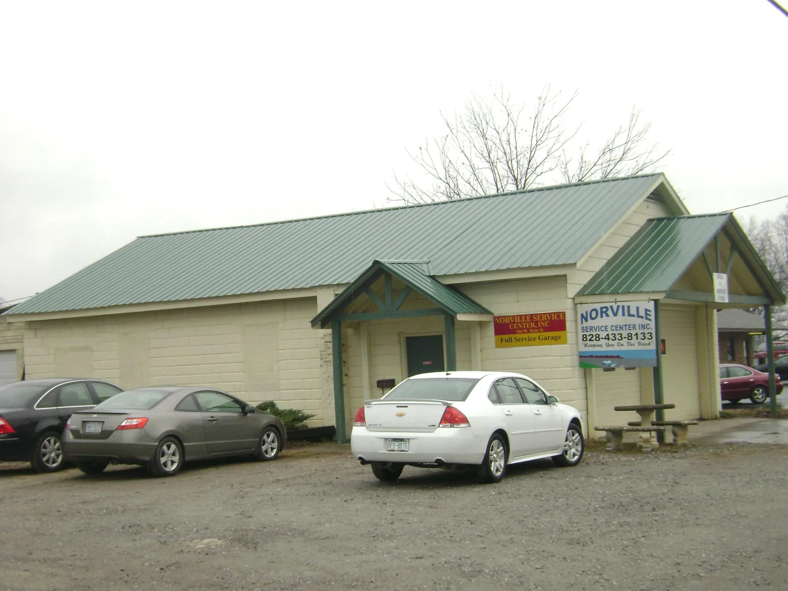 Green metal roof on a service garage with a covered entry in Lebanon